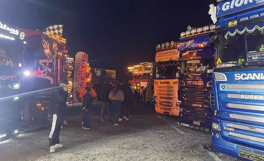 Axos trucks by night. 